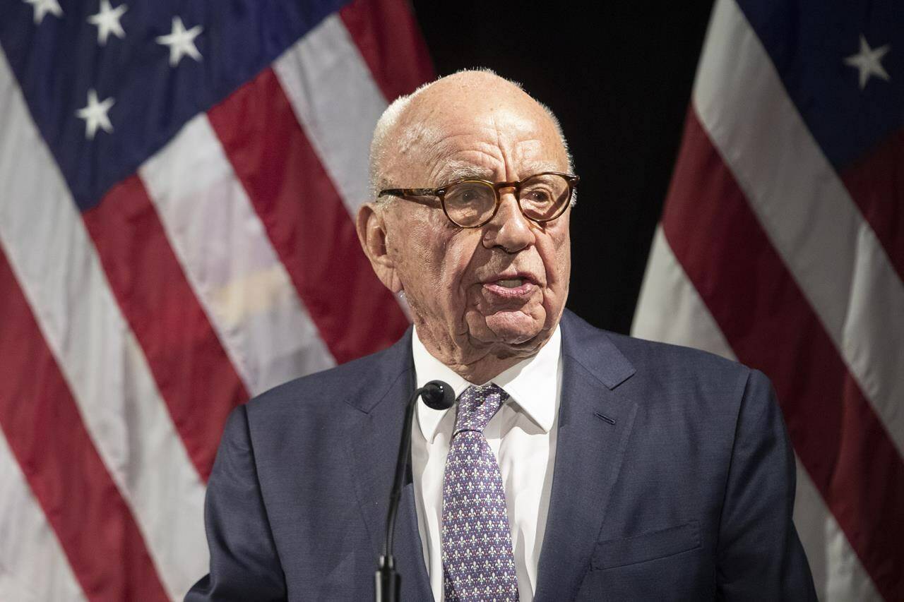 FILE - Rupert Murdoch introduces Secretary of State Mike Pompeo during the Herman Kahn Award Gala, in New York, Oct. 30, 2018. Murdoch is stepping down at Fox and News Corp, son Lachlan will take over as chairman .(AP Photo/Mary Altaffer, File)