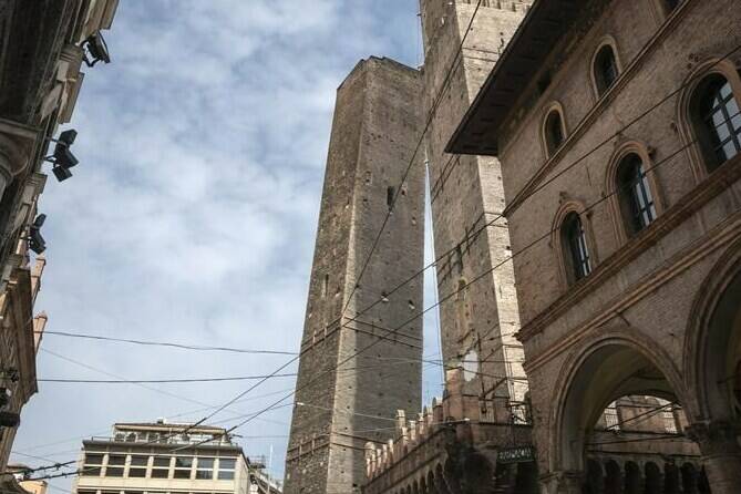 The Garisenda, left, and Asinelli towers are pictured in Bologna, Italy, March 20, 2020. Bologna’s Garisenda tower has been locked down for fear it could collapse. Authorities have provided a security cordon in case of collapse.The Garisenda tower along with the Asinelli(97meters)tower is one of the beauties and attractions for tourists visiting Bologna, and a landmark for citizens. (Massimo Paolone, Lapresse Via AP)