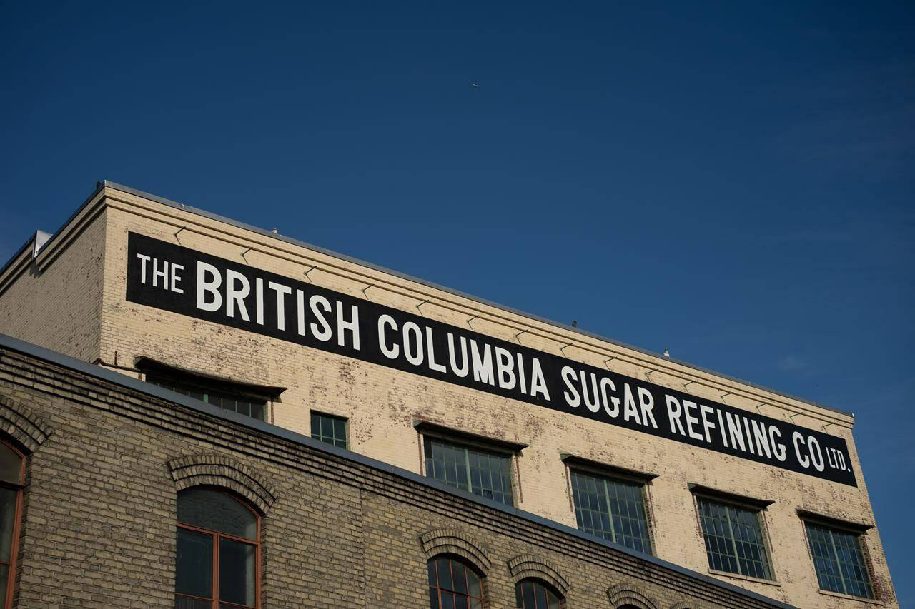 Rogers Sugar Inc. says unionized workers at its Vancouver refinery have ratified a new collective agreement. The British Columbia Sugar Refinery sign is seen outside of Rogers Sugar in Vancouver, on Thursday, Nov. 16, 2023. THE CANADIAN PRESS/Ethan Cairns