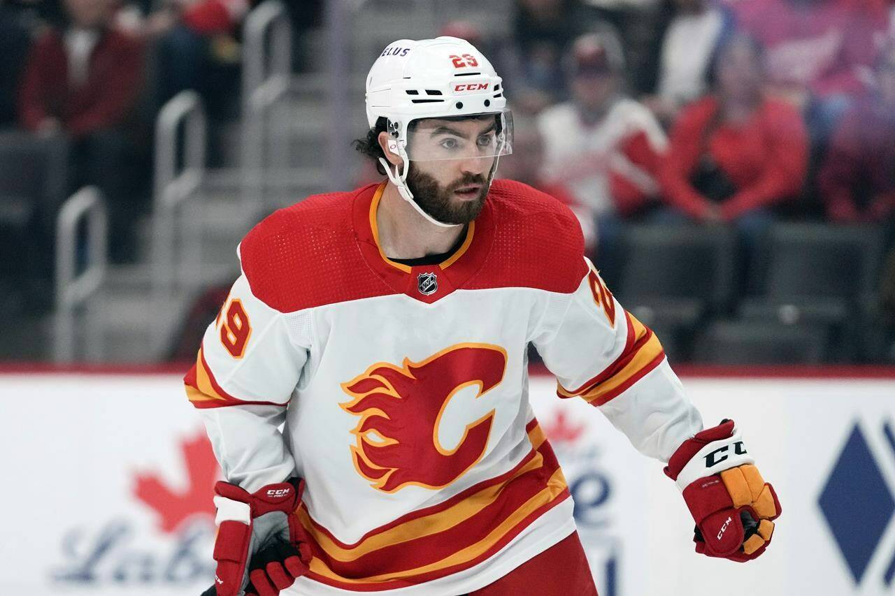 FILE - Calgary Flames center Dillon Dube (29) skates against the Detroit Red Wings in the first period of an NHL hockey game Sunday, Oct. 22, 2023, in Detroit. Five players from Canada’s 2018 world junior team have taken a leave of absence from their respective clubs in recent days amid a report that five members of that team have been asked to surrender to police to face sexual assault charges. New Jersey’s Michael McLeod and Cal Foote, Philadelphia’s Carter Hart, Calgary’s Dillon Dube and former NHL player Alex Formenton have all been granted indefinite leave, with the absences announced this week. (AP Photo/Paul Sancya, File)