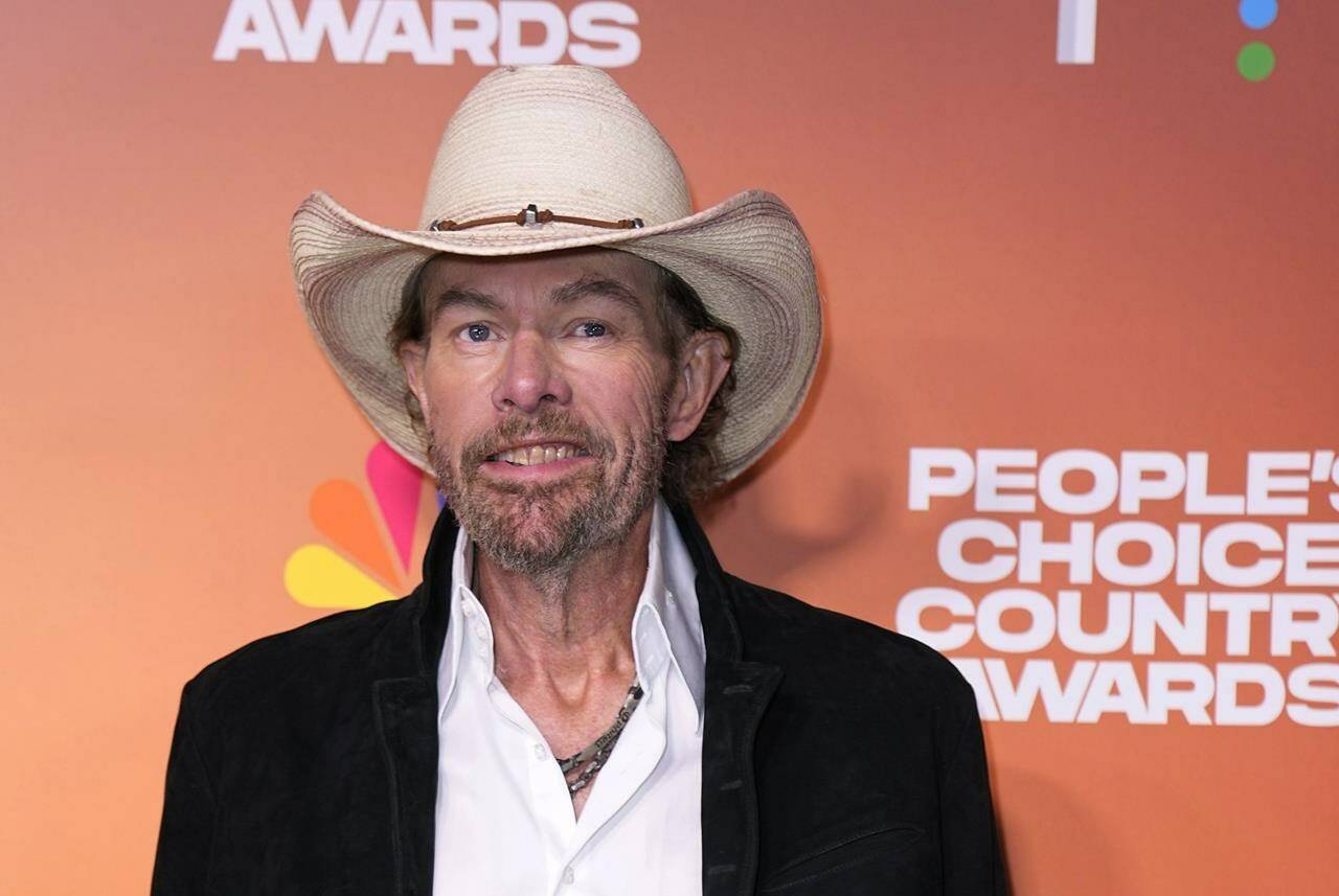 FILE - Toby Keith arrives at the People’s Choice Country Awards on Thursday, Sept. 28, 2023, at The Grand Ole Opry House in Nashville, Tenn. “Beer For My Horses” singer-songwriter Toby Keith has died. He was 62. Keith passed peacefully on Monday, Feb. 5, 2024 surrounded by his family, according to a statement posted on the country singer’s website. (AP Photo/George Walker IV, File)