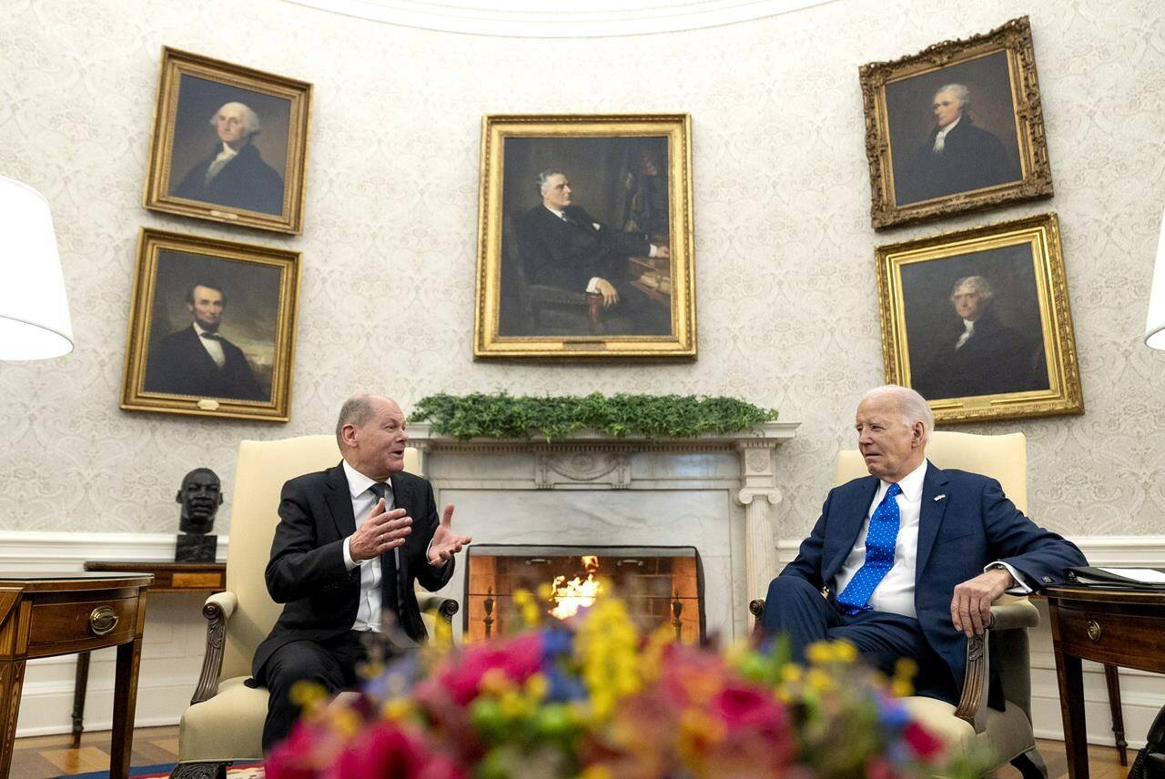 President Joe Biden, right, meets with German Chancellor Olaf Scholz in the Oval Office of the White House, Friday, Feb. 9, 2024, in Washington. (AP Photo/Andrew Harnik)