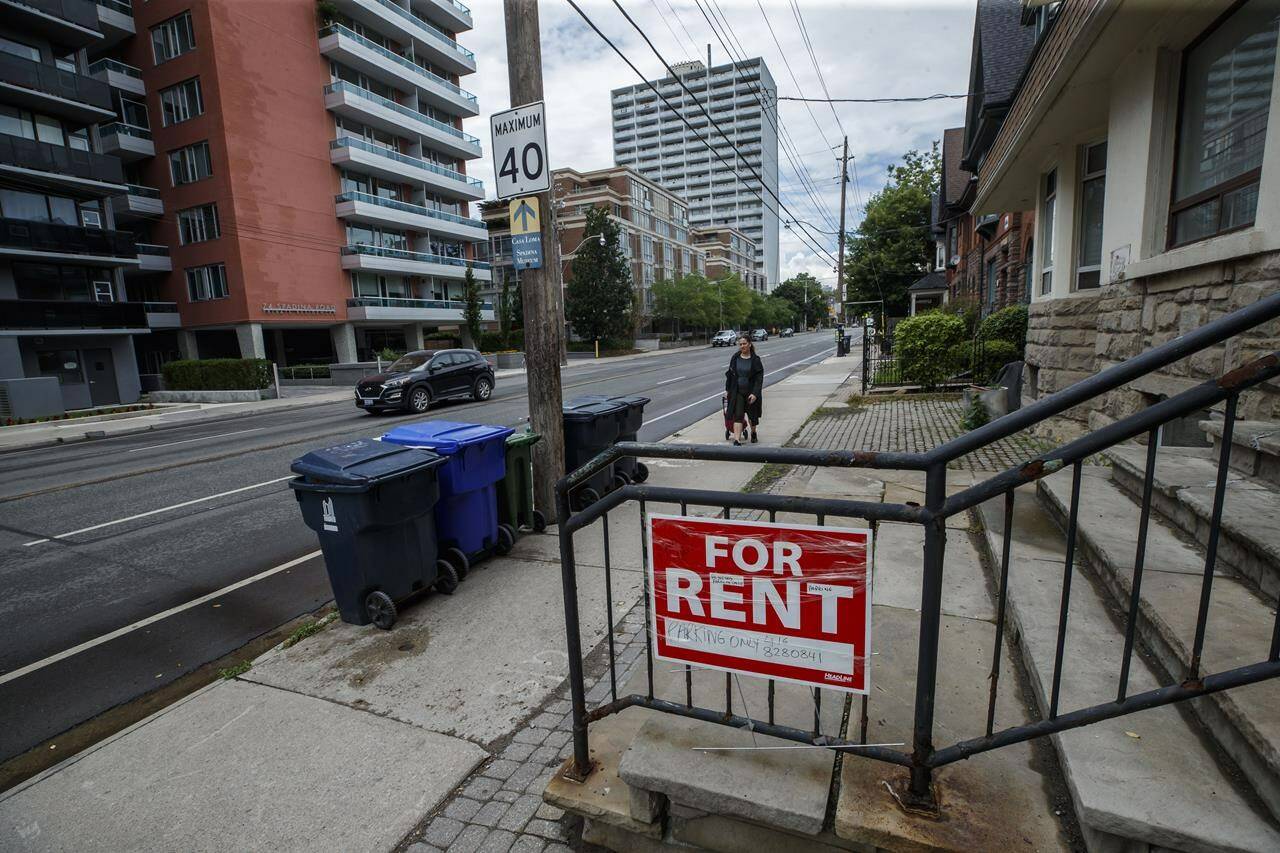 Renters across the country faced record low vacancy rates and record high rent increases in 2023, but Statistics Canada says Toronto and Vancouver residents who don’t own their homes face the greatest financial and mental pressures. A “For Rent” sign is posted outside a home in Toronto, Tuesday, July 12, 2022. THE CANADIAN PRESS/Cole Burston