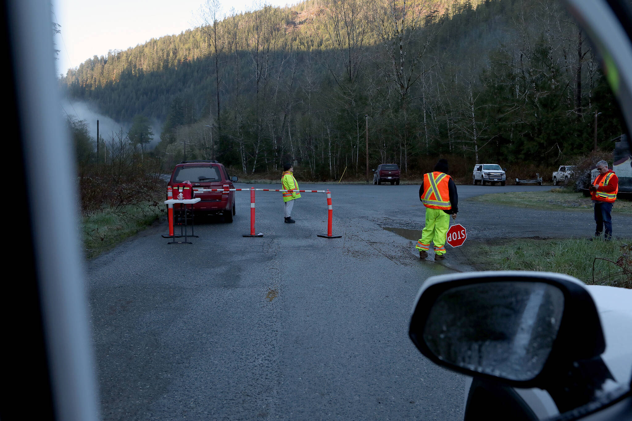 A road block as been set up on the only road into the lagoon as a rescue attempt is underway to rescue the orphaned two-year-old female orca calf near Zeballos, B.C., on Friday, April 12, 2024. THE CANADIAN PRESS/Chad Hipolito