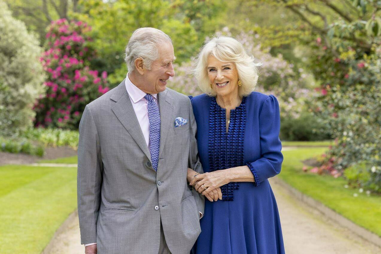 Britain’s King Charles III and Queen Camilla stand in Buckingham Palace Gardens on Wednesday April 10, 2024, the day after their 19th wedding anniversary. This photo is being released on Friday, April 26, 2024, to mark the first anniversary of their Coronation. Buckingham Palace says King Charles III will resume his public duties next week following treatment for cancer. The announcement on Friday April 26, 2024, comes almost three months after Charles took a break from public appearances to focus on his treatment for an undisclosed type of cancer. (Millie Pilkington/Buckingham Palace via AP)
