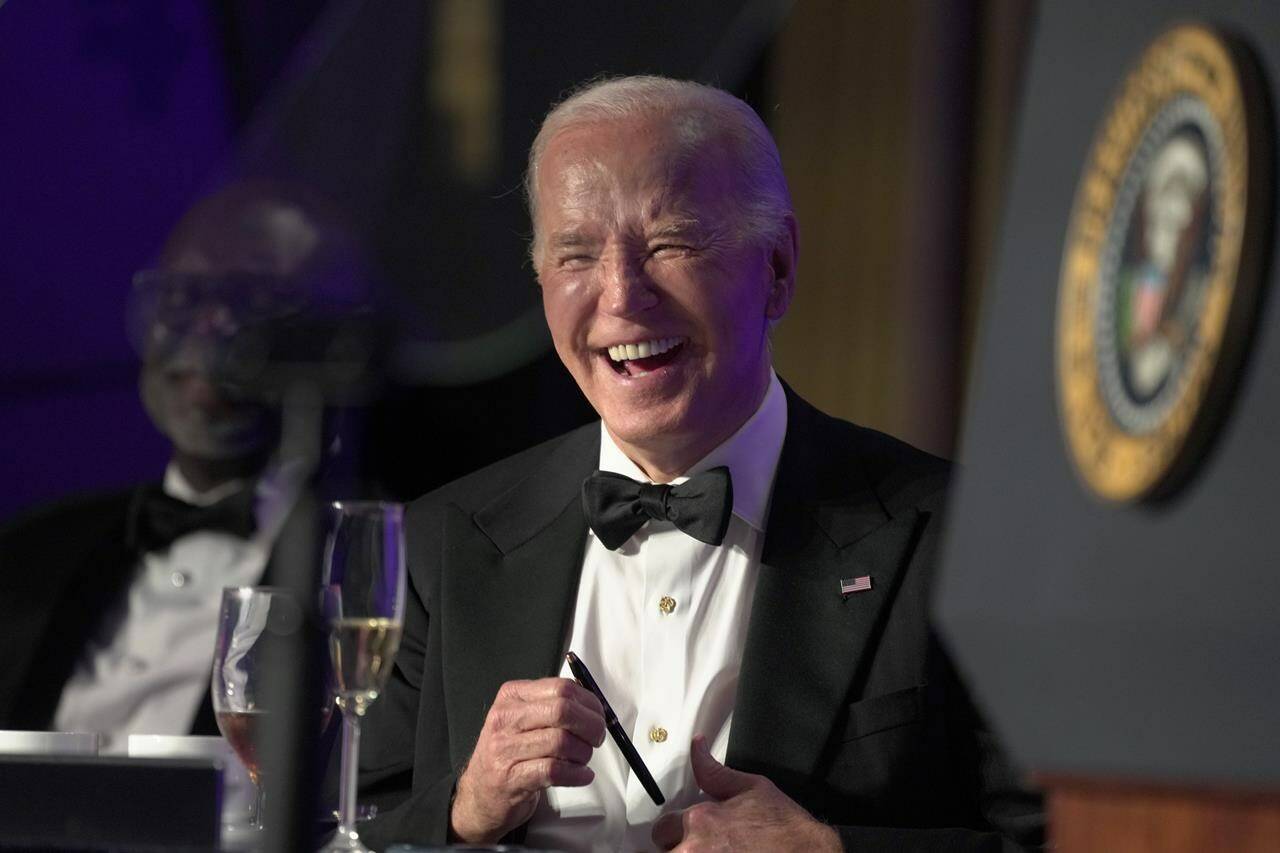 President Joe Biden laughs as host Colin Jost speaks at the White House Correspondents’ Association Dinner at the Washington Hilton, Saturday, April 27, 2024, in Washington. (AP Photo/Manuel Balce Ceneta)