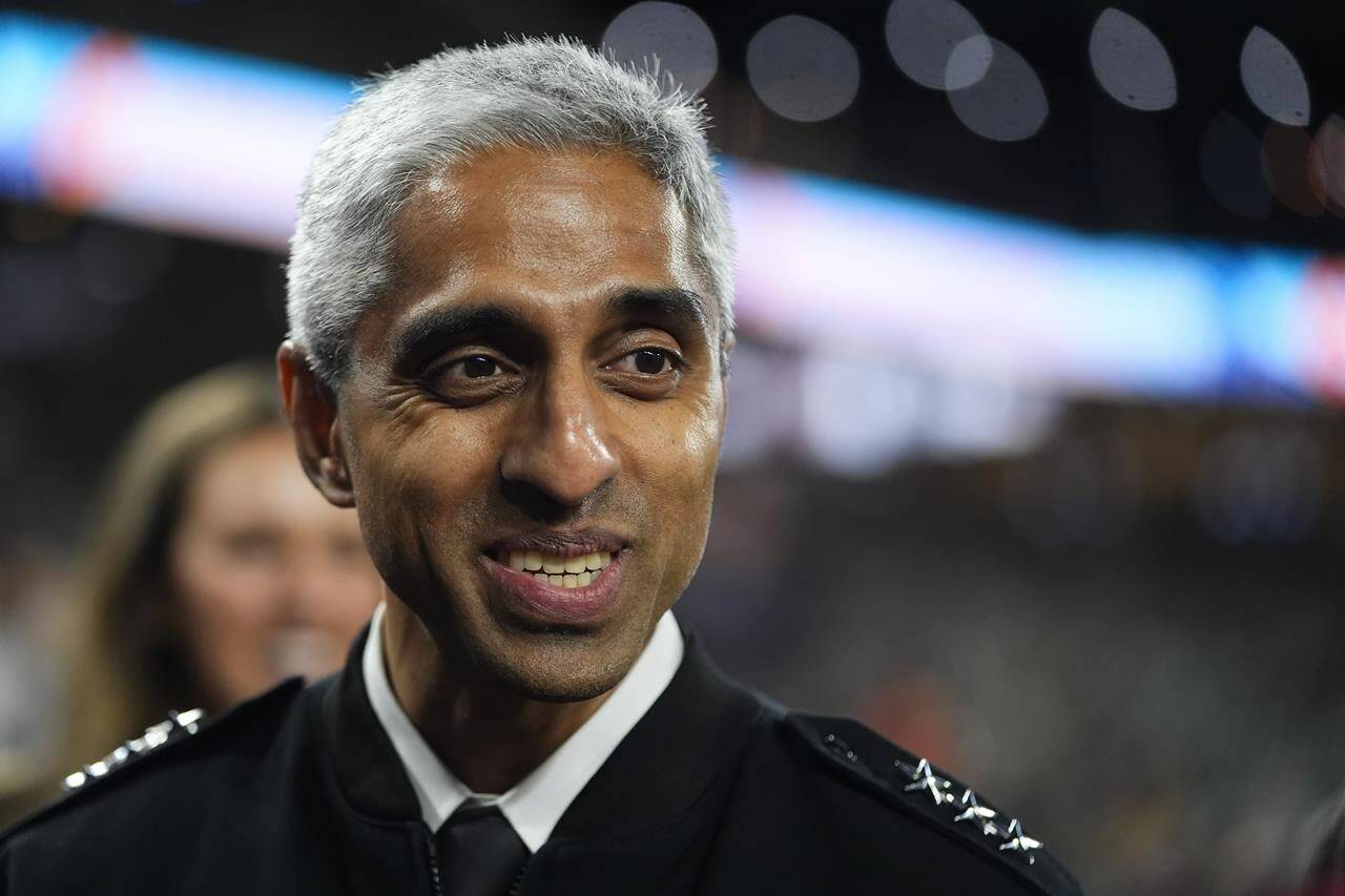 United States Surgeon General Dr. Vivek H. Murthy arrives to throw out the first pitch before a baseball game between the Seattle Mariners and the Houston Astros, Wednesday, May 29, 2024, in Seattle. (AP Photo/Lindsey Wasson)