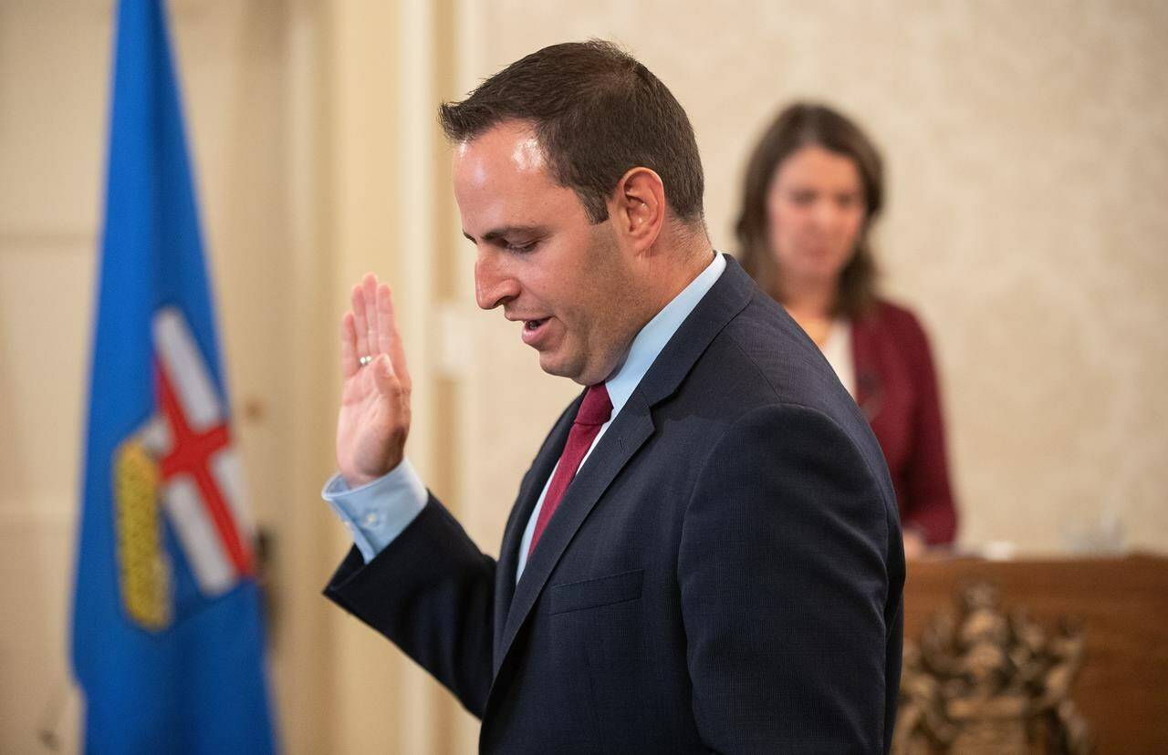 Alberta Education Minister Demetrios Nicolaides says the province is moving to ban cellphones in kindergarten to Grade 12 classrooms starting in the fall. Nicolaides is sworn into cabinet, in Edmonton, Friday, June 9, 2023. THE CANADIAN PRESS/Jason Franson.